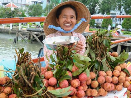 Cai Rang Floating Market, Woman in Boat Selling Fruit