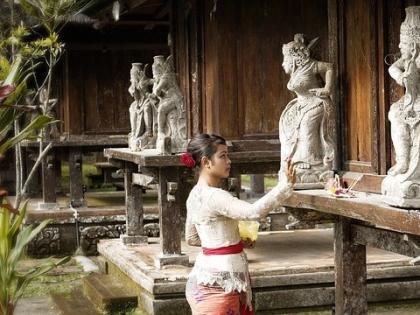 Woman praying in Bali