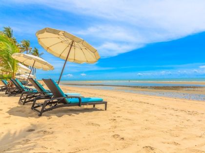 Umbrellas and chair, Beach with blue sky, Hua Hin, Thailand