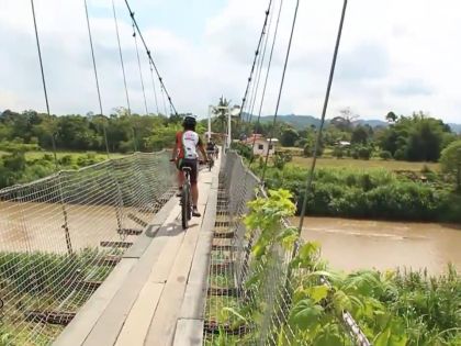 Hanging Bridge Kiulu on bicycle, Sabah, Borneo