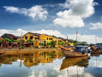 Wooden boats on the Thu Bon River in Hoi An Ancient Town, Vietnam