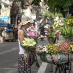 Hanoi Street Vendor selling flowers
